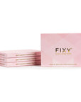 Four-pack of FIXY Magnetic Makeup Palettes stacked together, made from post-consumer recycled plastic, with a clear top, white base, and extra strong magnet, showcasing the brand's commitment to eco-friendly beauty solutions. Size Medium 4.3"x5.7"