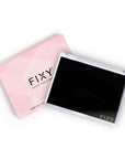 FIXY Medium 4.3x 5.7 Magnetic Makeup Palette, crafted from post-consumer recycled plastic, presented next to its geometric patterned box featuring a clear top, white base, and an extra-strong magnet, demonstrating the brand's eco-friendly packaging and product design.